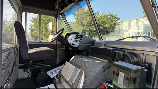 Driver seat, steering wheel, and dash of the step van